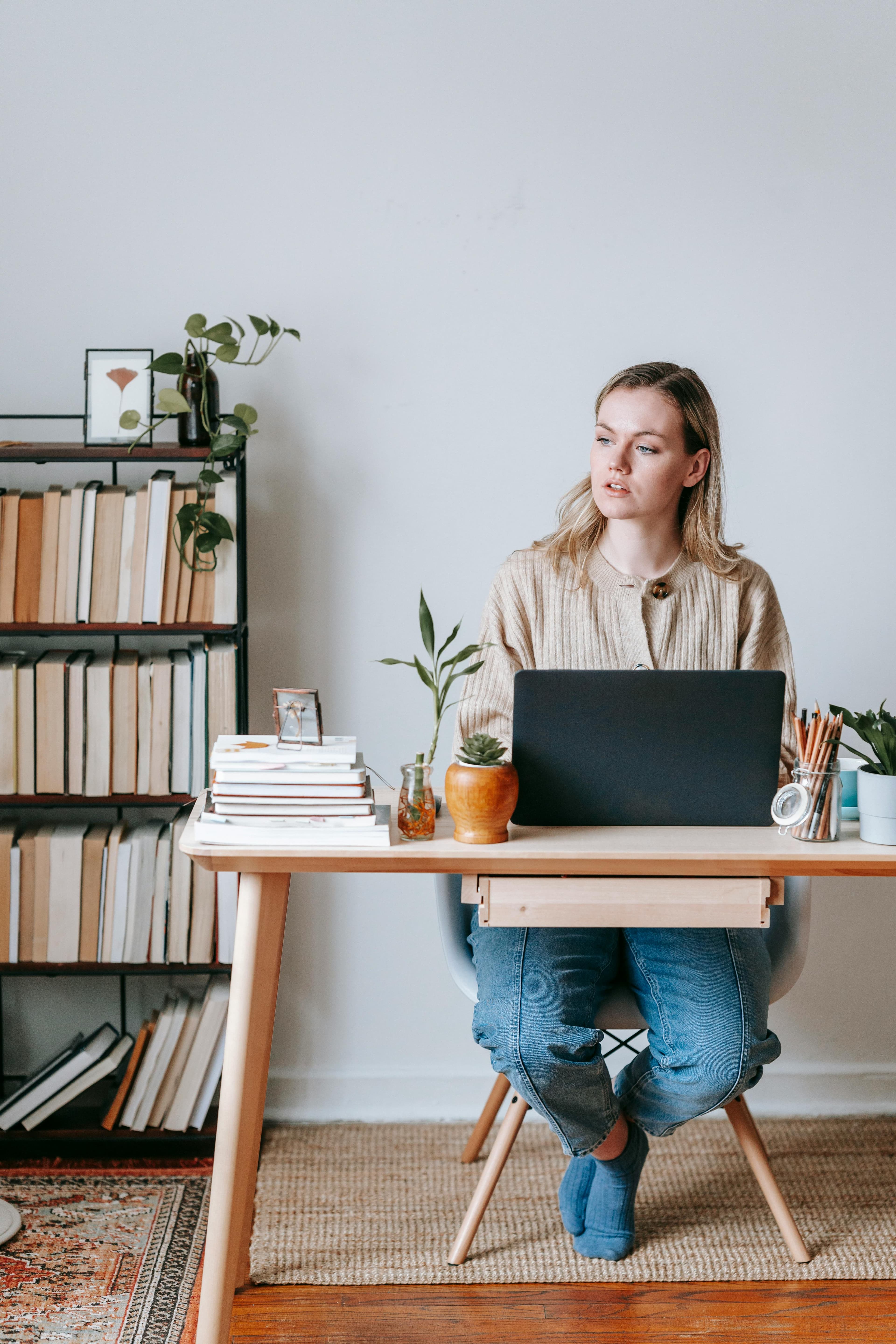 Young renter reviewing landlord details on a laptop at home